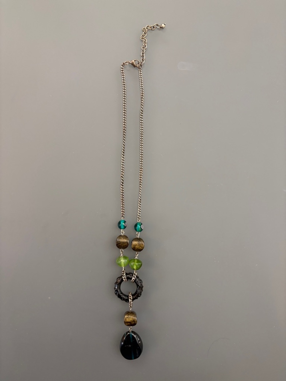 Silver-Tone Necklace with Green and Black Bead Pendant
